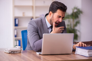 Young businessman employee working in the office