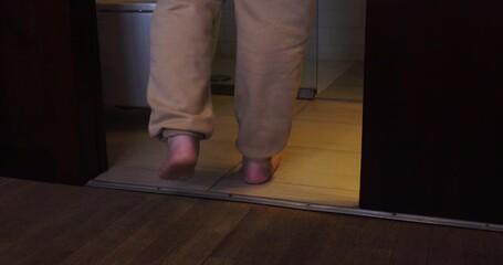 A woman goes to the toilet and sits on the toilet.The process of defecation. Toilet at home. Healthy bowel movements in the morning.