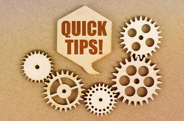On a paper background, gears and a thought plate with the inscription - Quick Tips