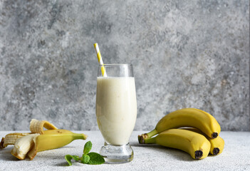 Banana cocktail with ice cream and milk. Fruit milkshake. Breakfast smoothie.