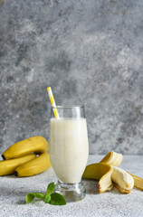 Banana cocktail with ice cream and milk. Fruit milkshake. Breakfast smoothie.