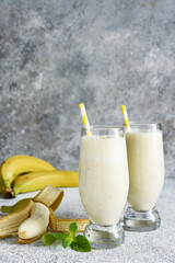 Banana cocktail with ice cream and milk. Fruit milkshake. Breakfast smoothie.