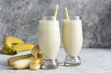 Banana cocktail with ice cream and milk. Fruit milkshake. Breakfast smoothie.
