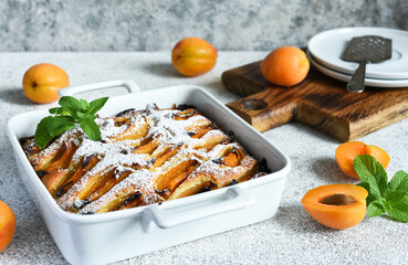 cake with apricots. Homemade pie with peaches and apricots on the kitchen table.