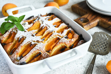 cake with apricots. Homemade pie with peaches and apricots on the kitchen table.