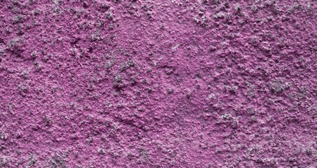 Pink wall surface with scratched paint