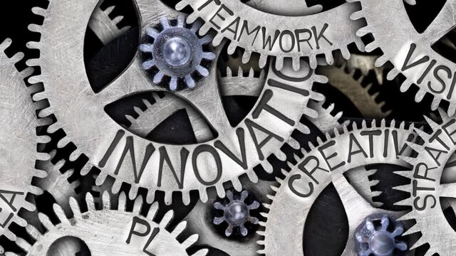 Group of rotating tooth wheels with Innovation sign imprinted on metal surface. Concept of Idea, Creativity and Strategy. High quality 4k video.