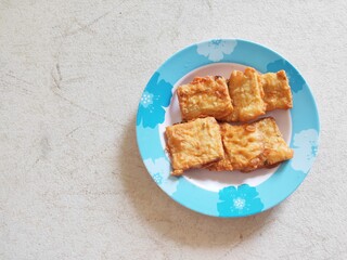 Tempeh or Tempe in Plate. Tempe is Traditional Food From Indonesia.