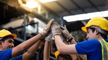Unity and teamwork concept. team standing hands together. Professional Mechanical Engineer team Working at Second-hand spare parts of old car parts warehouse store.