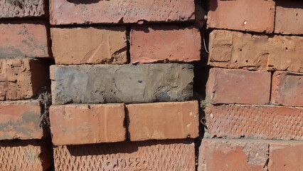 Neatly stacked old bricks