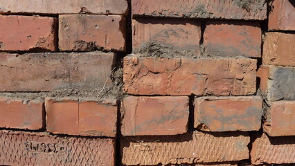 Old bricks neatly stacked in a row