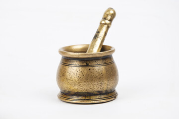Closeup shot of an old bronze pounder with a pestle isolated n white background - obrazy, fototapety, plakaty