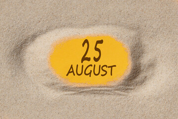 August 25. 25th day of the month, calendar date. Hole in sand. Yellow background is visible through hole. Summer month, day of the year concept