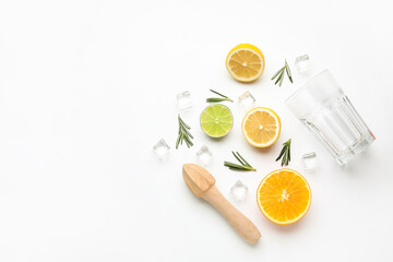 Composition with glass and healthy citrus fruits on white background