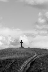 Fototapeta na wymiar Cross on the hill, black and white.