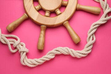 Helm and rope on color background