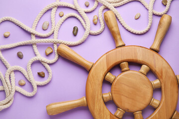 Helm and rope on color background