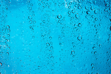 closeup water drops blue background,