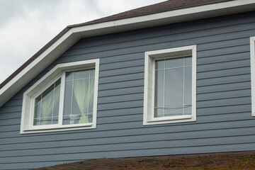 Country house outside the city. Residential building windows.