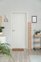 Interior of modern hallway with stadiometer