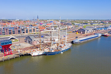 Fototapeta na wymiar Aerial from the city Harlingen with traditional sailing ships in the Netherlands