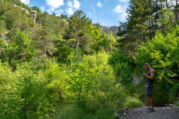Obraz premium Hiking les Demoiselles coiffées in France during the last month of Spring