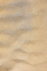 Fototapeta na wymiar Sand beach texture. Natural background. Sand waves background. Sandy dunes, tropical seashore landscape.