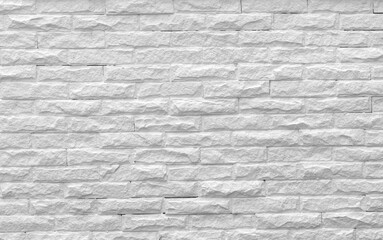 Surface white wall of stone wall gray tones for use as background.