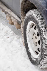 Fototapeta na wymiar Snow with salt on the car chassis.