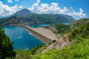 Obraz na płótnie Canvas Hydro electric dam and large man made lake in the French Alps