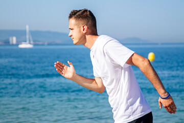 man running on the beach sand