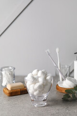 Bowl with soft cotton wool on table