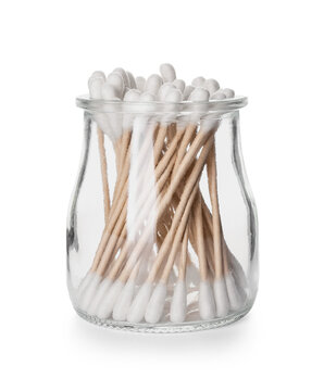 Glass jar with cotton swabs on white background