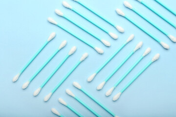 Cotton swabs on color background