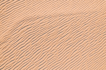 Wind wave vortices in sand background from aerial top view