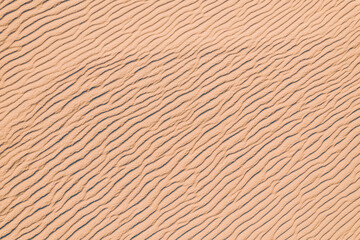 Wind wave vortices in sand background from aerial top view