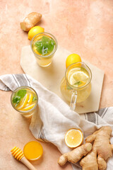 Cold ginger lemonade on color background