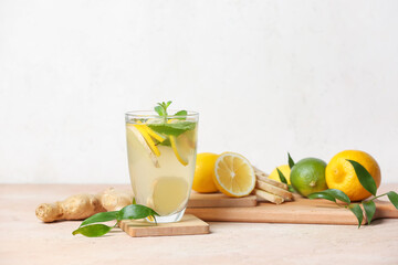Glass of cold ginger lemonade on table