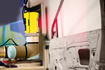 Robot arm performs 3D scan of manufactured part of machine for quality control on automated...