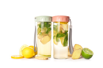 Bottles of cold ginger lemonade on white background