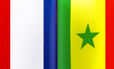 Naklejka premium fragments of the national flags of France and the Republic of Senegal close-up