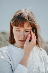 A young woman exploring the beach and the dunes. Enjoying the sea