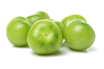 Green tomatoes on white background