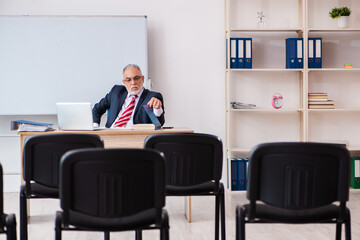 Old male business couch in the classroom during pandemic