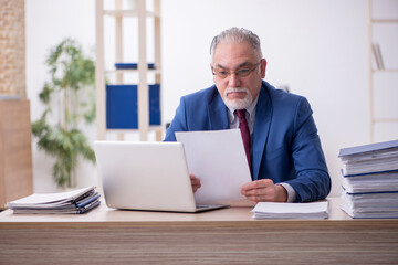 Old male employee and too much work in the office