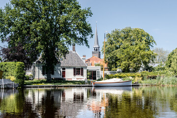 Fototapeta premium Dutch houses in the typical Dutch town Broek in Waterland, the Netherlands