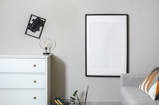Interior of modern stylish room with blank photo frame