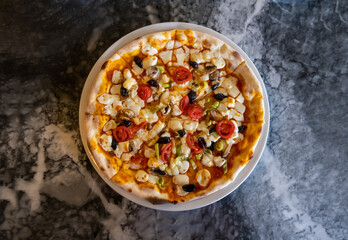 pizza on marble floor, top view