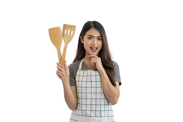 Young Asian housewife holding a wooden spatula isolated on white background