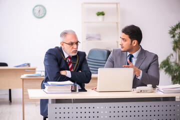 Old male boss holding snake on his neck